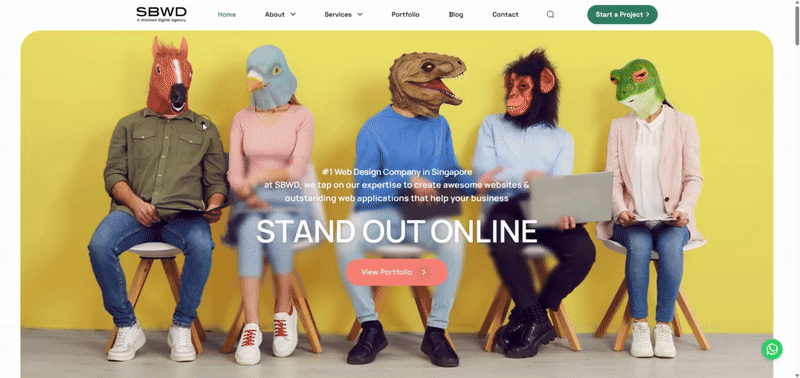 People in animal masks sit on chairs, representing creativity and innovation.