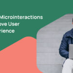 Man engaging with laptop showcases microinteractions enhancing user experience.