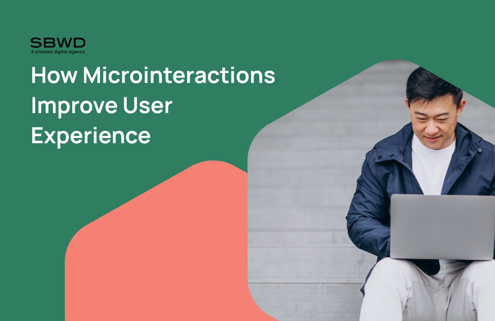 Man engaging with laptop showcases microinteractions enhancing user experience.